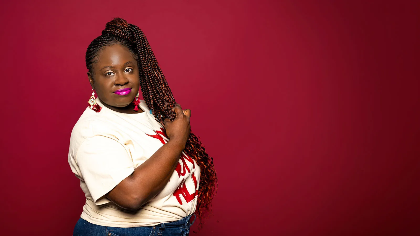 A TWU Student Clutching Maroon Braids