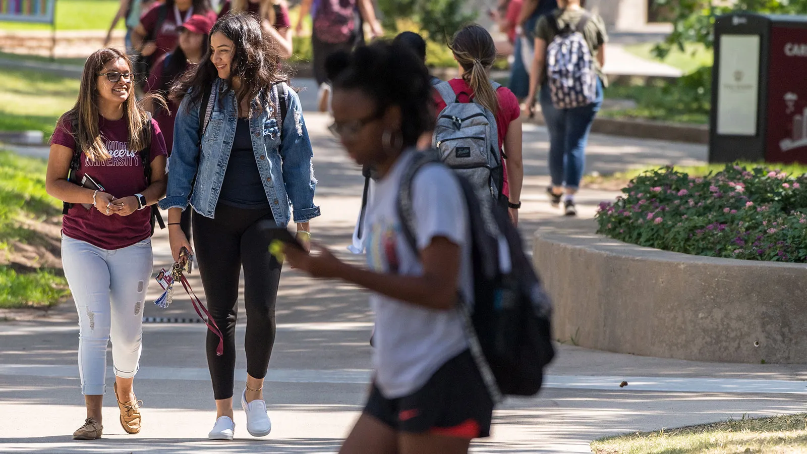 TWU Students Walking down Redbud Lane