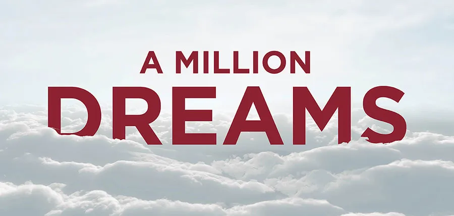 A background of gray clouds with maroon text that says 'A Million Dreams' 