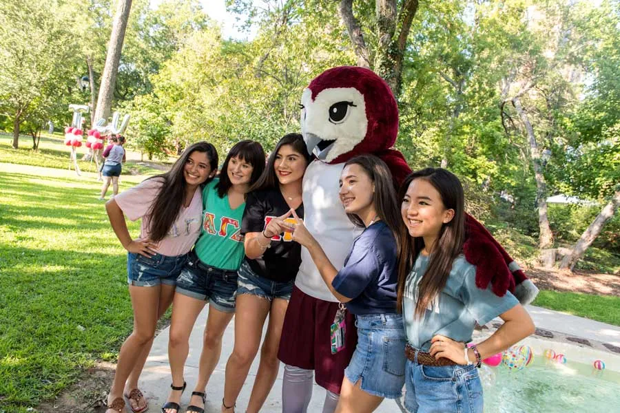 Sorority sisters pose with Oakley.
