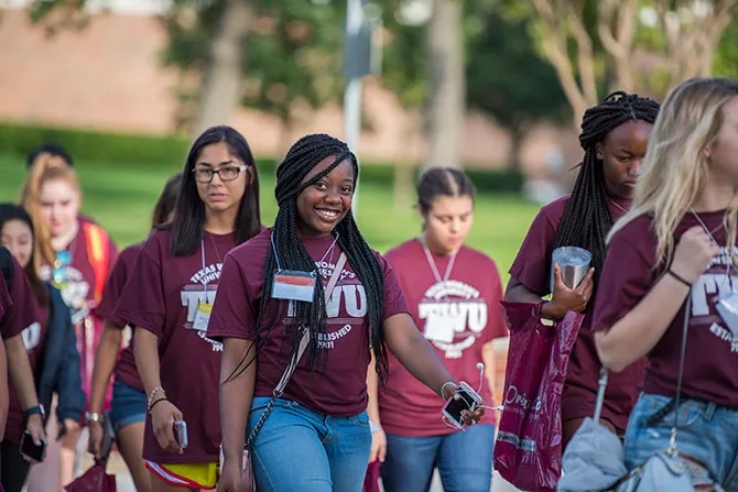 A walking tour with a group of TWU students on the Denton campus.