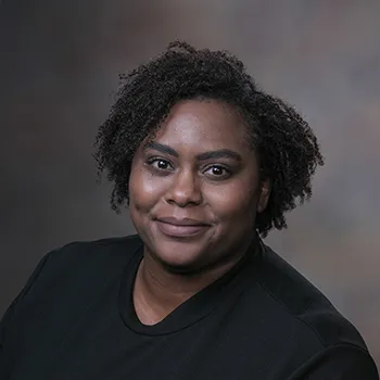 A headshot photo of Carmen Fisher