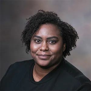 A headshot photo of Carmen Fisher