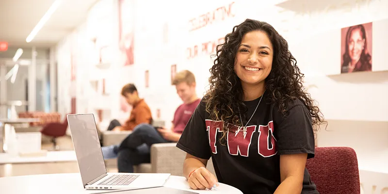 A TWU student studying in the Student Union at Hubbard Hall.