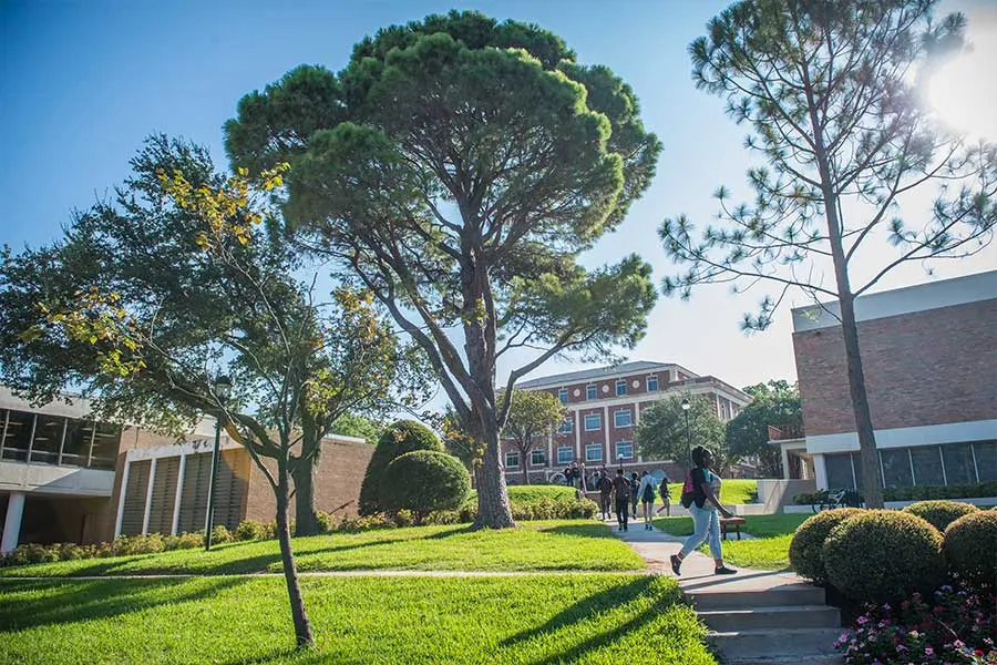 A student walking across campus