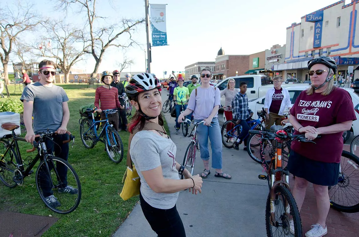 Students with their bikes at the Denton downtown square during the ARTSWALK 2016 bike parade