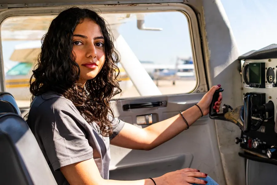 Danah Alramahi in the cockpit of an airplane