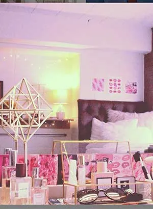 A pink, white and gold decorated desk in a Stark Hall dorm room.