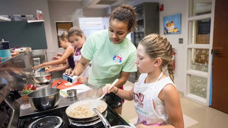 Children learn to cook at a TWU summer camp