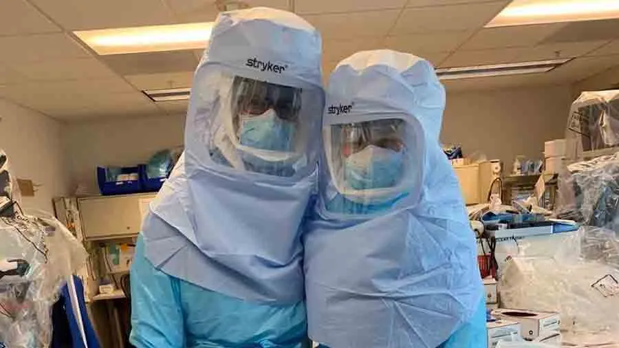 Houston TWU doctoral student Becky Ashlock on the right in full protective gear against COVID-19