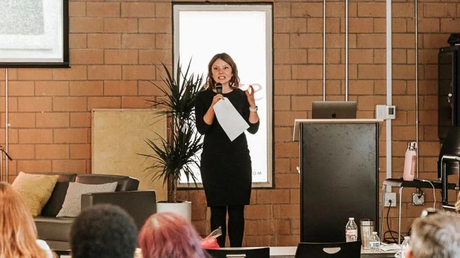 Emily Roden at speaking at Stoke in front of a crowd of women