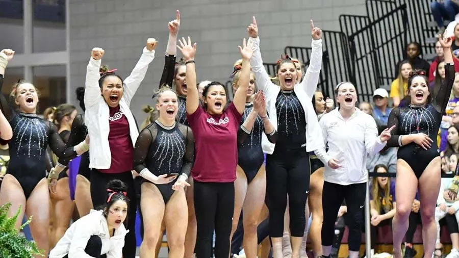 TWU gymnastics team cheering