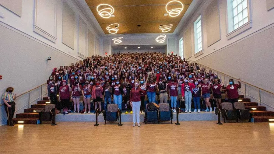 Chancellor Carine Feyten stands with TWU's Class of 2025