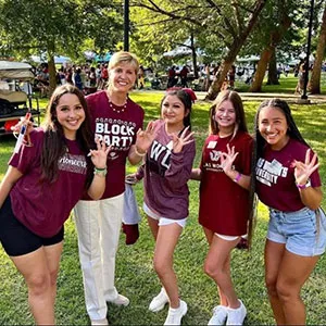 Chancellor Feyten with TWU students at the 2022 Block Party on the Denton campus