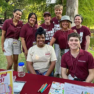 Chancellor Feyten with a group of students at the TWU Block Party