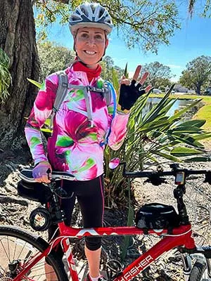 Chancellor Feyten with a bicycle outdoors