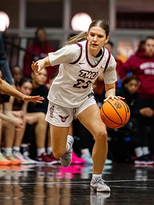 A TWU basketball player on the court