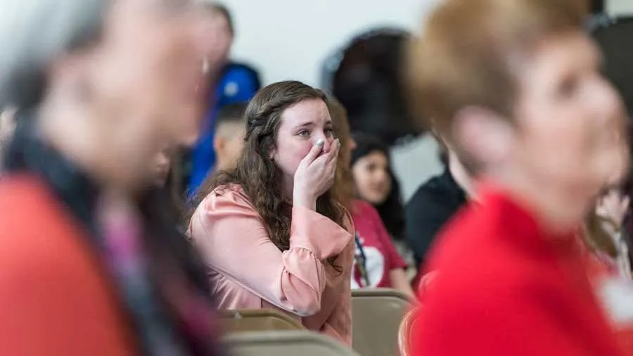High school student Caroline Dietch gasps in surprise as she learns she has a received a full scholarship to attend TWU