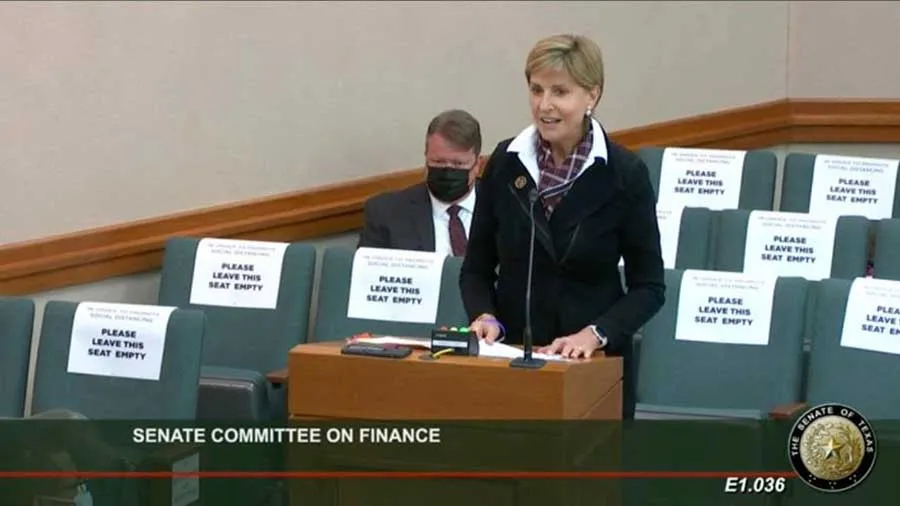 Chancellor Carine Feyten speaking before the Texas Senate Committee on Finance