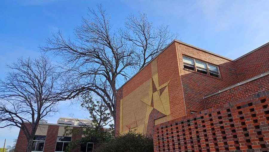 The giant star brick mural outside of the Patio Building on Oakland Street