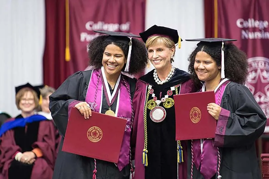 Chancellor Feyten with twin bachelor’s nursing honor students Jazmine and Marissa Maxwell