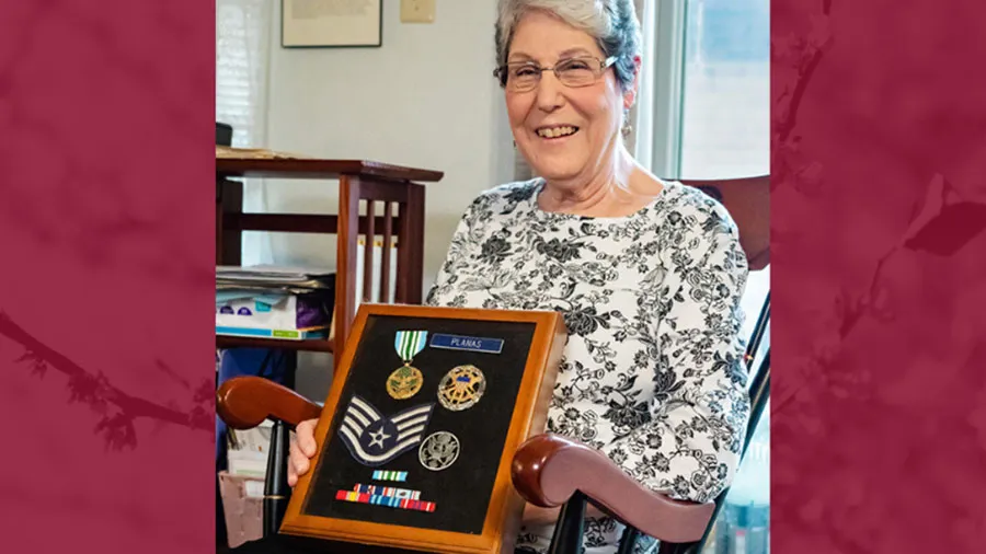 TWU alumna Dorothy Planas displays some of her military medals in a shadow box