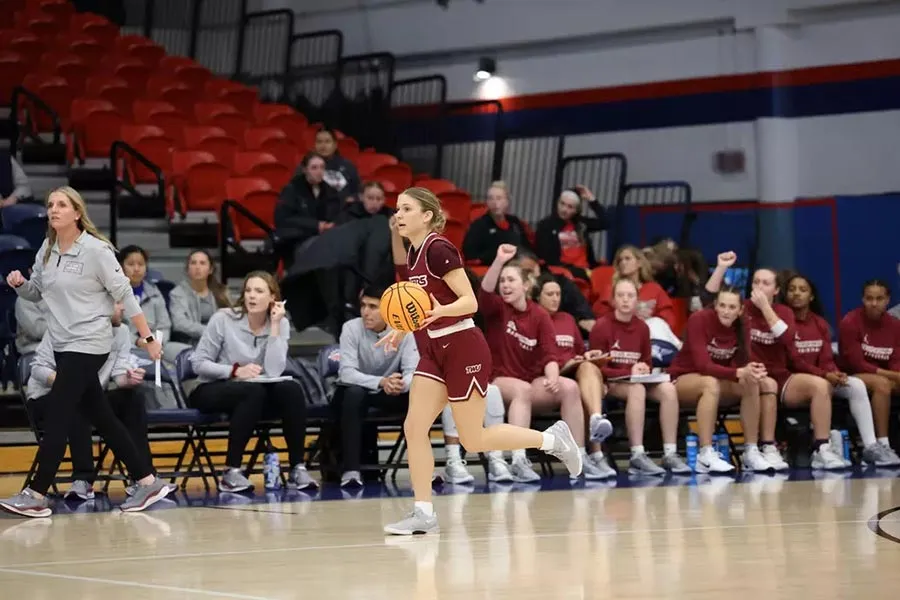 TWU Women's Basketball team in action on the court