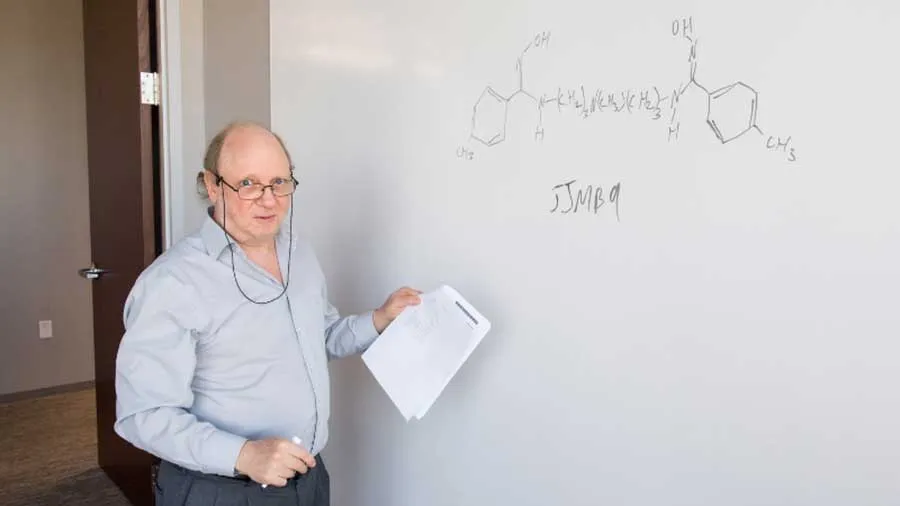 Dr. Michael Bergel in front of a whiteboard