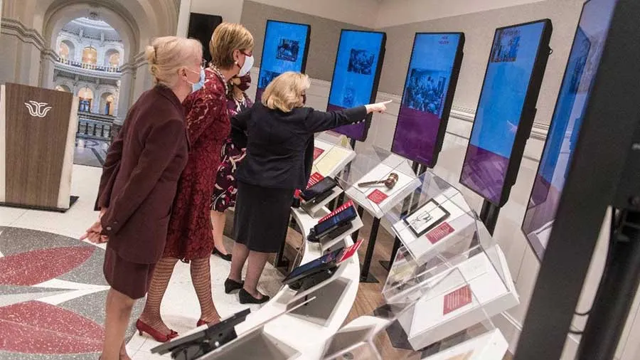 Chancellor Carine Feyten with Senator Jane Nelson, Sue Bancroft, and Jill Jester touring the new IWL interactive exhibit