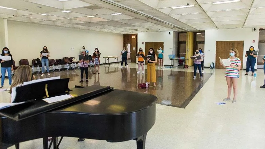 TWU’s nationally recognized Concert Choir perform while socially distant in the TWU Blagg-Huey Library