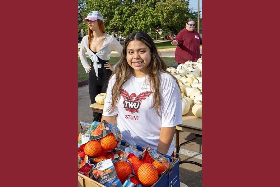 Athletics student helping out at Groceries to Go