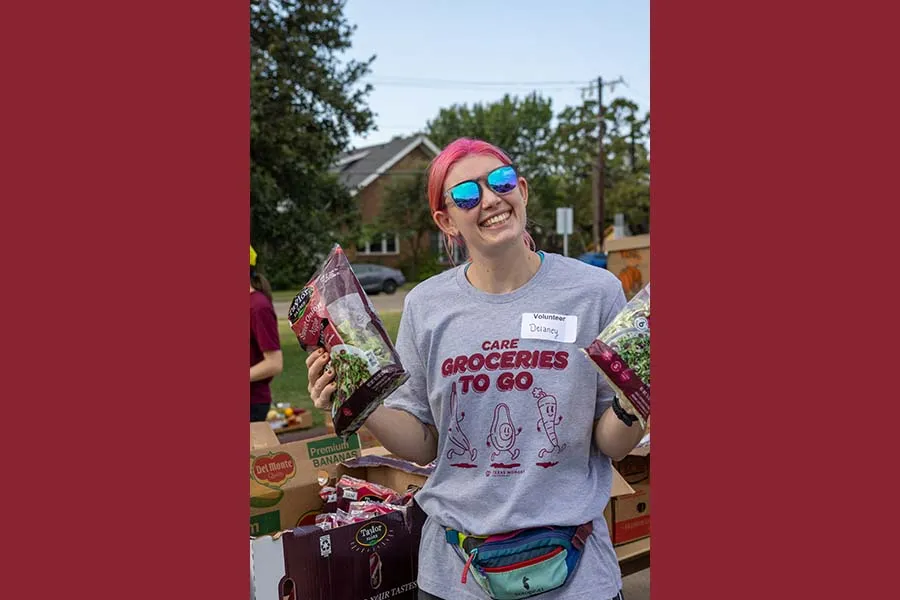 Athletics student helping out at Groceries to Go