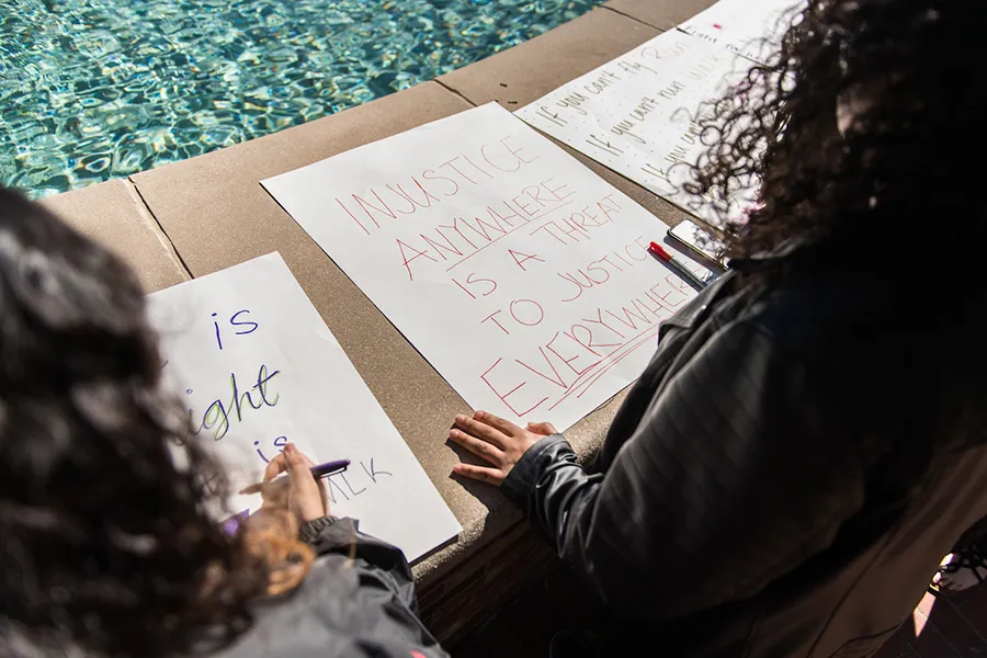 Students make signs on the MLK day of service
