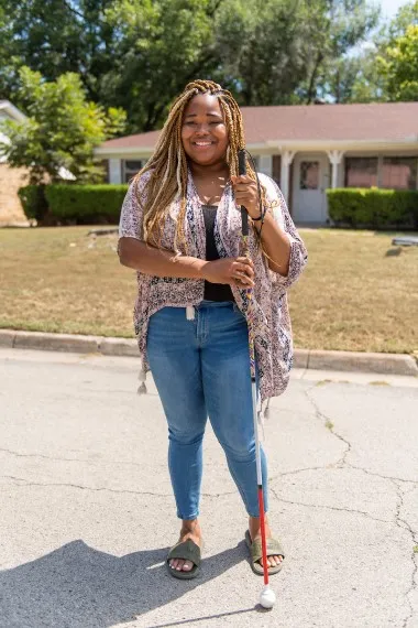 Demetria Ober stands in front of her Fort Worth home.