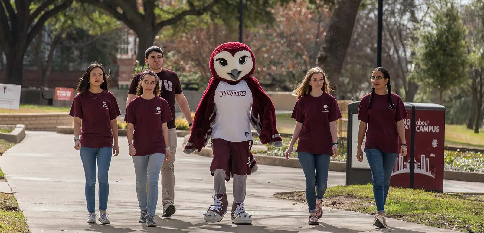 Oakley and students walking on campus