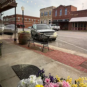 A street scene from a small rural Texas town with vintage early 1900s buildings