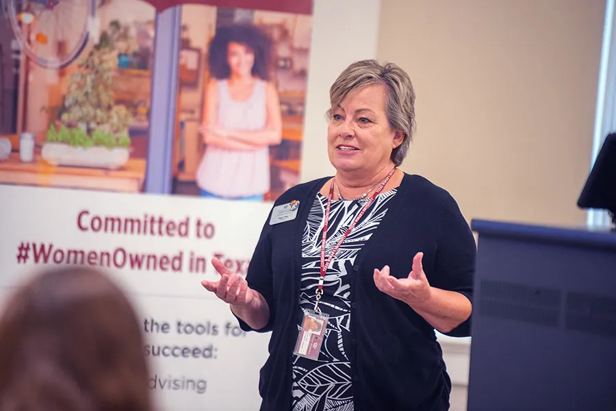 Tracy Irby gives a talk to local women entrepreneurs at a CWE event