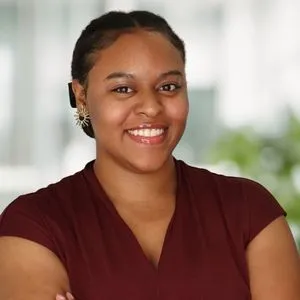 Nevaeh Gaines Headshot in a bright white office