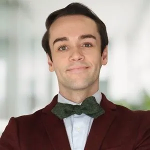 a headshot of tucker maberry in a bright white office
