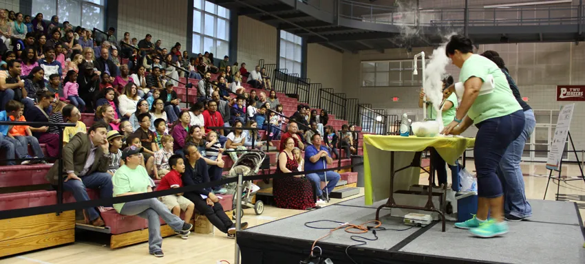 The KEM Club puts on a chemistry magic show for participants at TWU's annual science fair. 