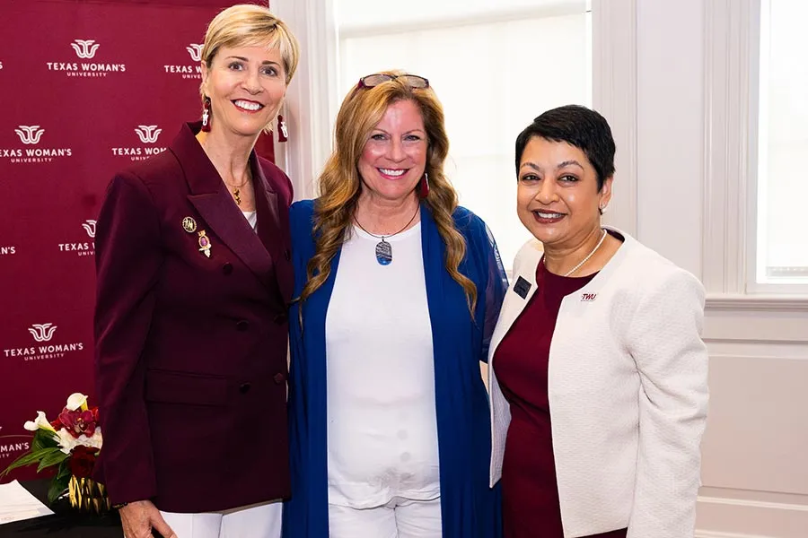 TWU Chancellor stands next to Merrilee Kick and Dean Yelkur
