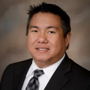 A portrait of Ken Boonme.