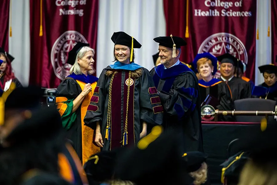 Hooding ceremony for a TWU Dallas graduate student