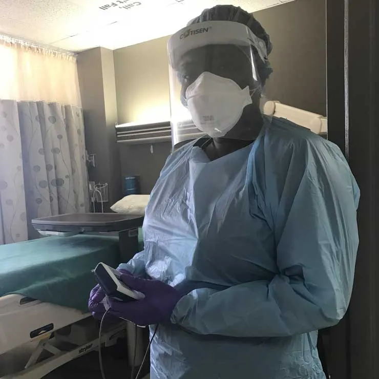 Dorothy Henking in medical gear in a hospital setting.