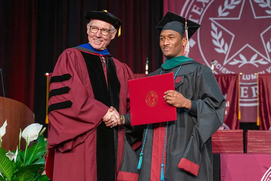Student receiving a diploma
