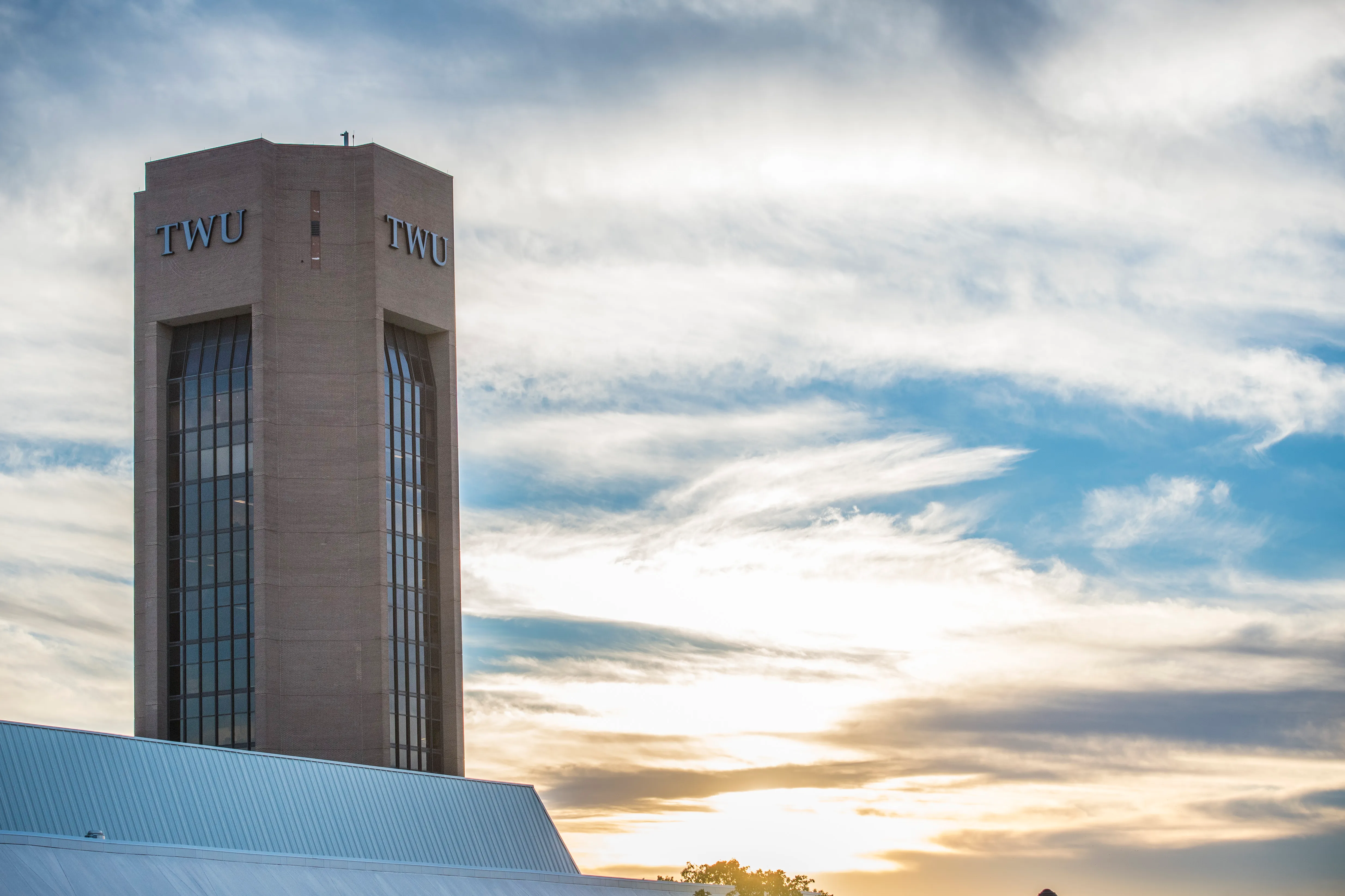 TWU tower with cloudy sky
