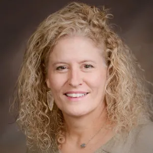 A portrait of Amy Teague smiling.