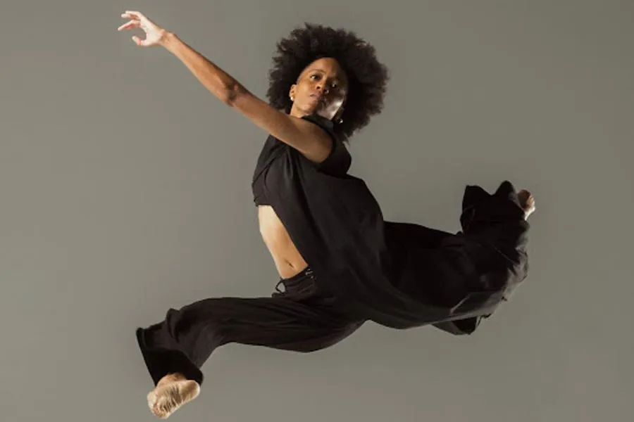 a dancer leaps in the air 