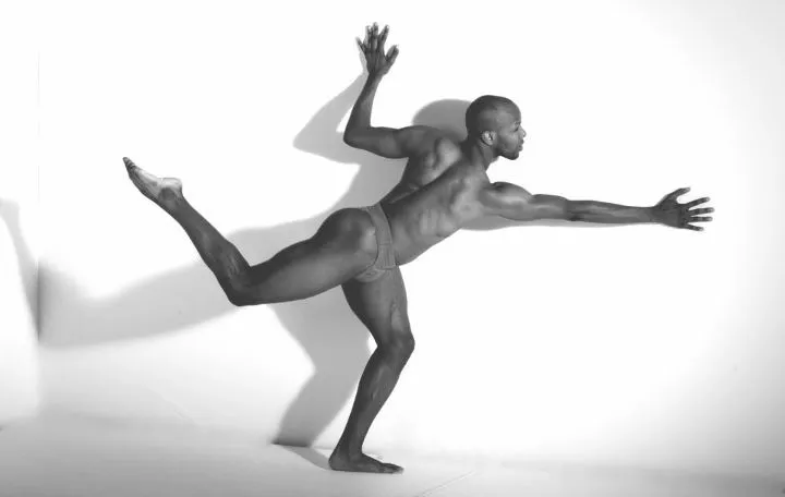 Trent D. Williams performs a dance in black and white 