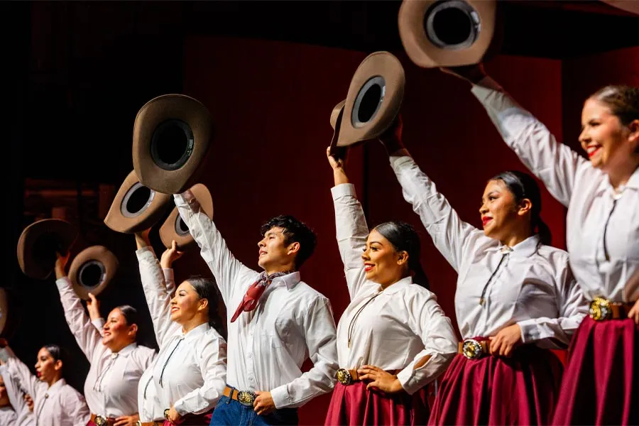 International Dance Company dancers with cowboy hats 